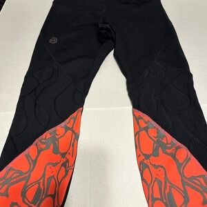 Under Armour Women's Black and Orange Leggings